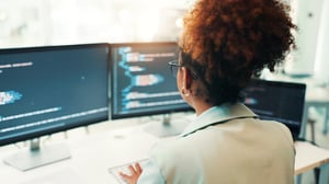 programmer-woman-computer-screen-with-typing-office-writing-code-app-development-debugging-back-programming-employee-with-data-analytics-software-testing-system-update