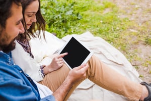 young-couple-browsing-tablet-nature